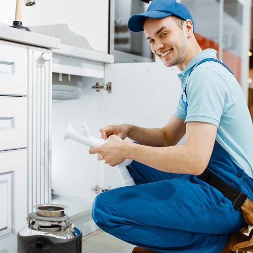 smiling-male-plumber-in-uniform-holds-drain-pipe-resize-q0a0vgvrdeeqz0vhvu2foz10l8qgl9o61zcx209lw0